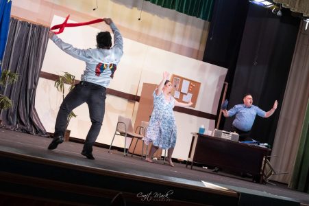 Actors engaged in a lively scene during a theatrical production at Fondazzjoni Teatrali Silvio Fleri Soler. Vibrant scene with actors performing on stage, showcasing theatrical talent and stagecraft.