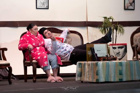 Two actors in costume during a rehearsal at Fondazzjoni Teatrali Silvio Fleri Soler, showcasing their performance. Actors rehearsing a scene on stage at Fondazzjoni Teatrali Silvio Fleri Soler.