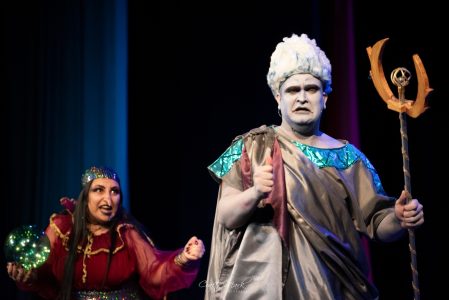 A dramatic moment captured during a theatrical play, featuring actors in colourful costumes and expressive gestures at Fondazzjoni Teatrali Silvio Fle. Vivid scene from a theatrical performance at Fondazzjoni Teatrali Silvio Fleri Soler, showcasing act.