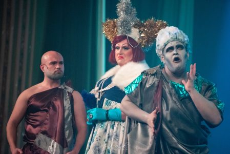 A scene from a theatrical performance featuring actors in elaborate costumes and makeup at Fondazzjoni Teatrali Silvio Fleri Soler. Actors in theatrical costumes performing on stage at Fondazzjoni Teatrali.