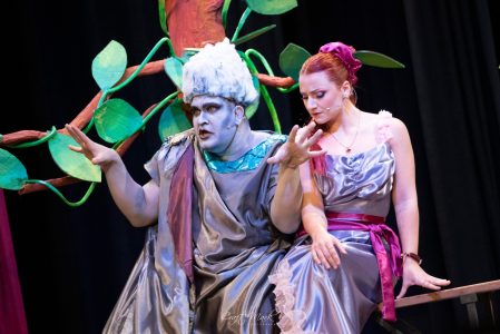 A theatrical performance featuring actors in colourful costumes and makeup, highlighting the artistic talent of Fondazzjoni Teatrali Silvio Fleri Sole. An actor in elaborate costume performing on stage.
