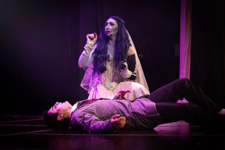 A scene from a pantomime performance titled "Korps Brajd" at Fondazzjoni Teatrali Silvio Fleri Soler. A performer in a theatrical pantomime scene with a woman on stage.