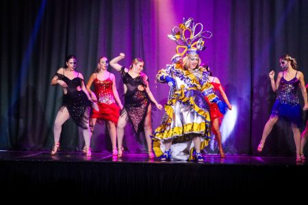 Dancers and a performer in elaborate costume perform in a pantomime titled 'Korps Brajd' at Fondazzjoni Teatrali Silvio Fleri Soler. Performers in colourful costumes during a pantomime show on stage.